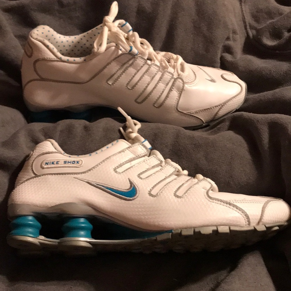 Female pair of Nike Shox. White with blue details.